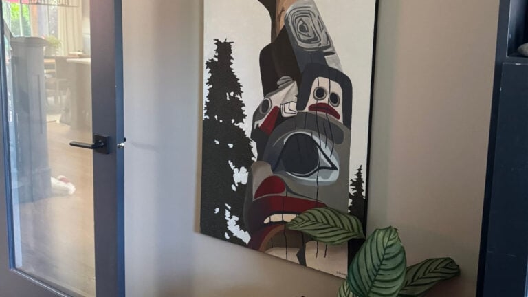 Benjamin MOore Pashmina (Greige-taupe) walls with totem pole indigenous artwork and Cheating Heart painted door