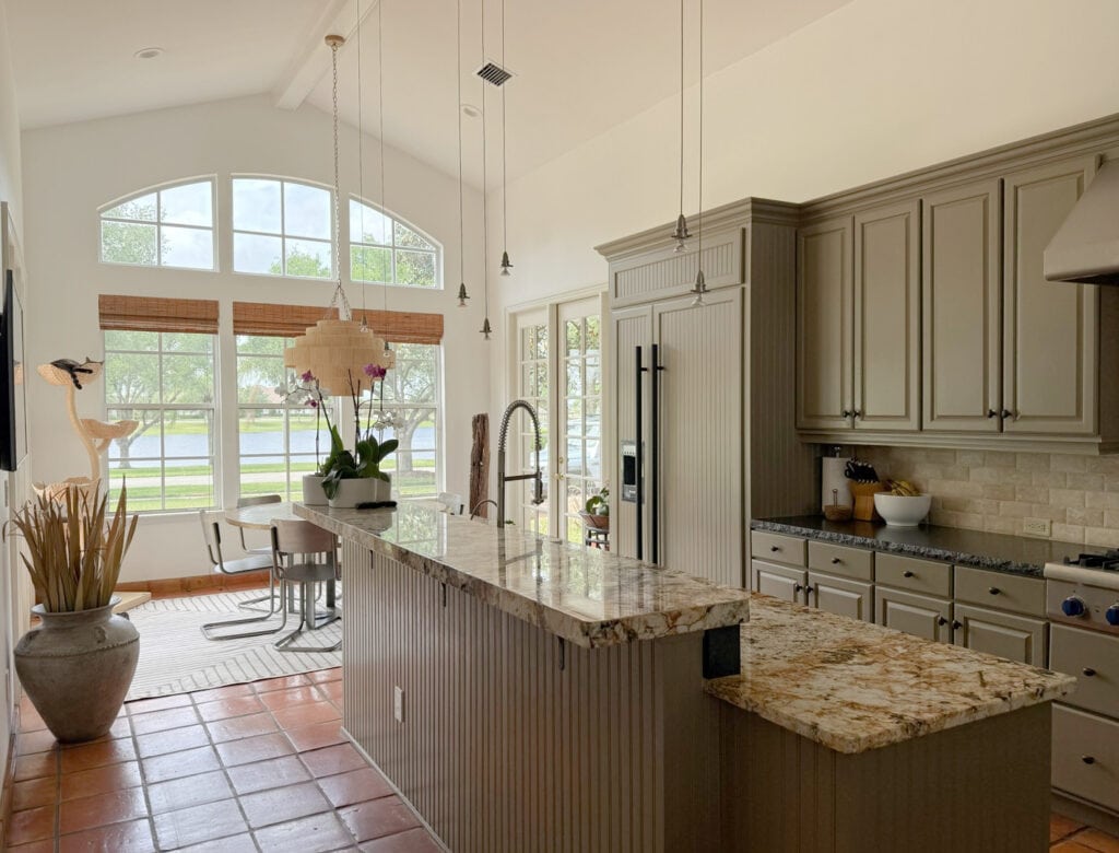Sherwin Williams High Reflective White or Extra White in west-facing exposure, mexican terracotta tile floor, gold granite, greige kitchen cabinets, vaulted ceiling
