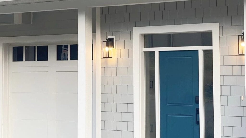 white exterior trim paint colors on north-facing exterior with blue door and gray siding