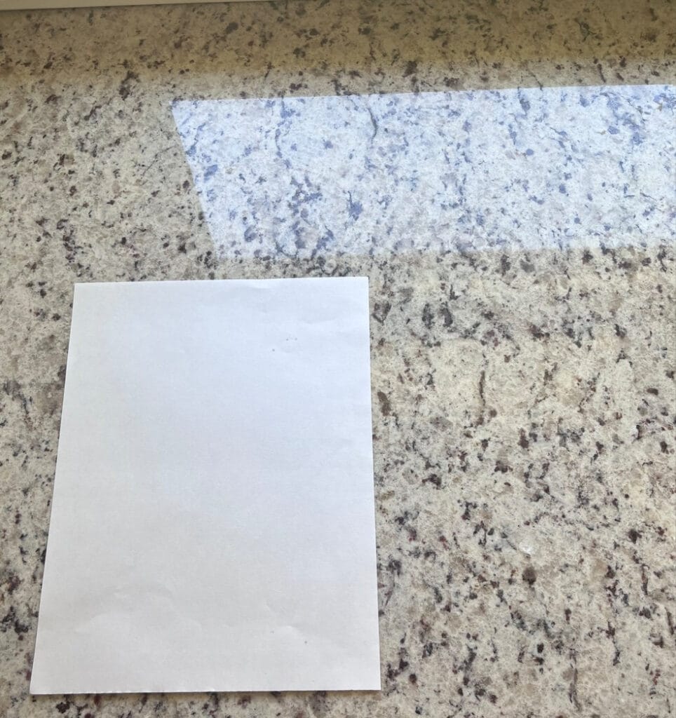2000s granite countertop with beige and off-white speckles. Is, or similar to Giallo Ornamental