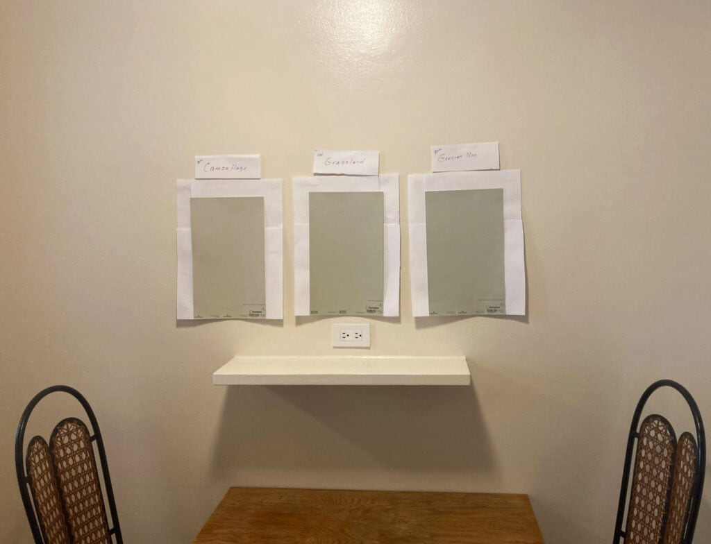 Benjamin Moore Navajo White walls, Camouflage and Grecian Green samplize samples and Sherwin Williams Grassland. Northern, muted light