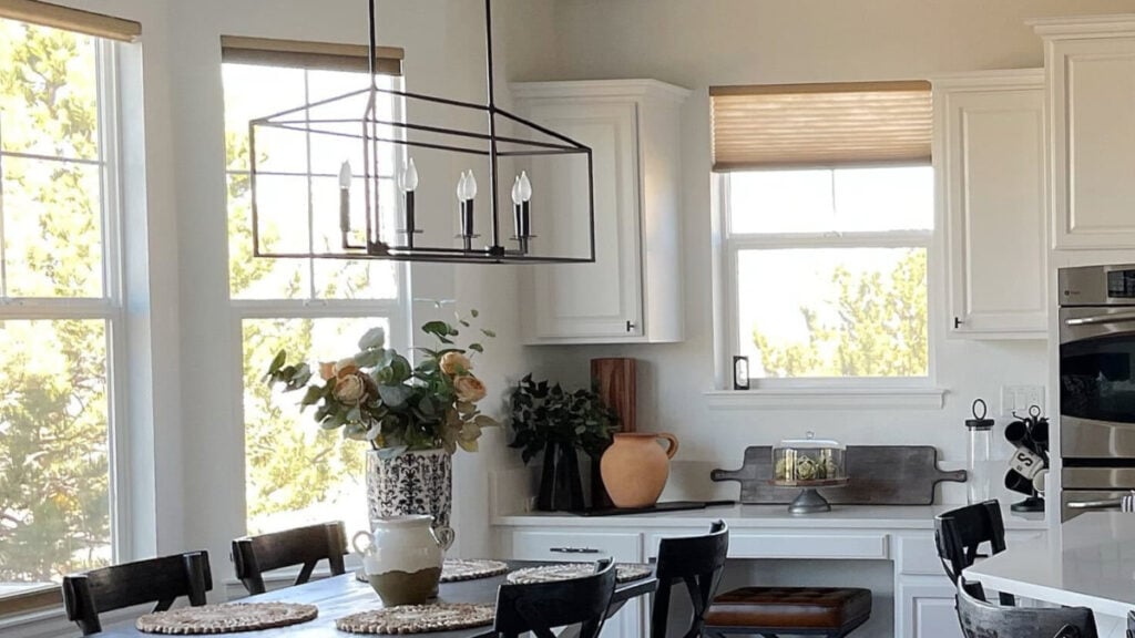 Sherwin Williams Pure White in a kitchen and dining area. ON walls, cabinets, and trim. Colors for east-facing rooms