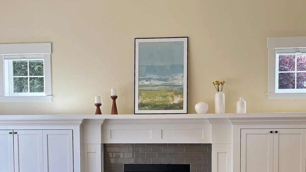 Cream walls painted Sherwin Williams Vanillin, Pure White trim and built-ins around fireplace with warm gray subway tile, wood floor, east-facing with small south windows (5)