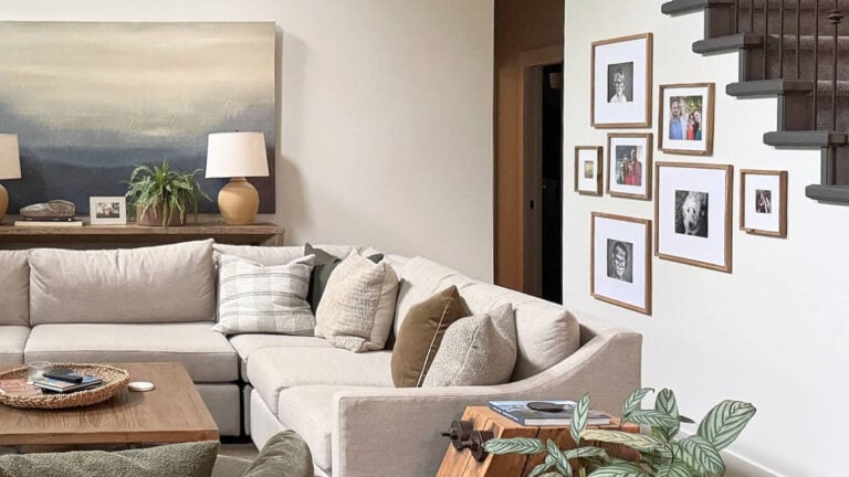 SHERWIN WILLIAMS AESTHETIC WHITE IN A NORTH-FACING ROOM WITH SECTIONAL, GALLERY WALL AND HOME DECOR. LOT OF NATURAL LIGHT