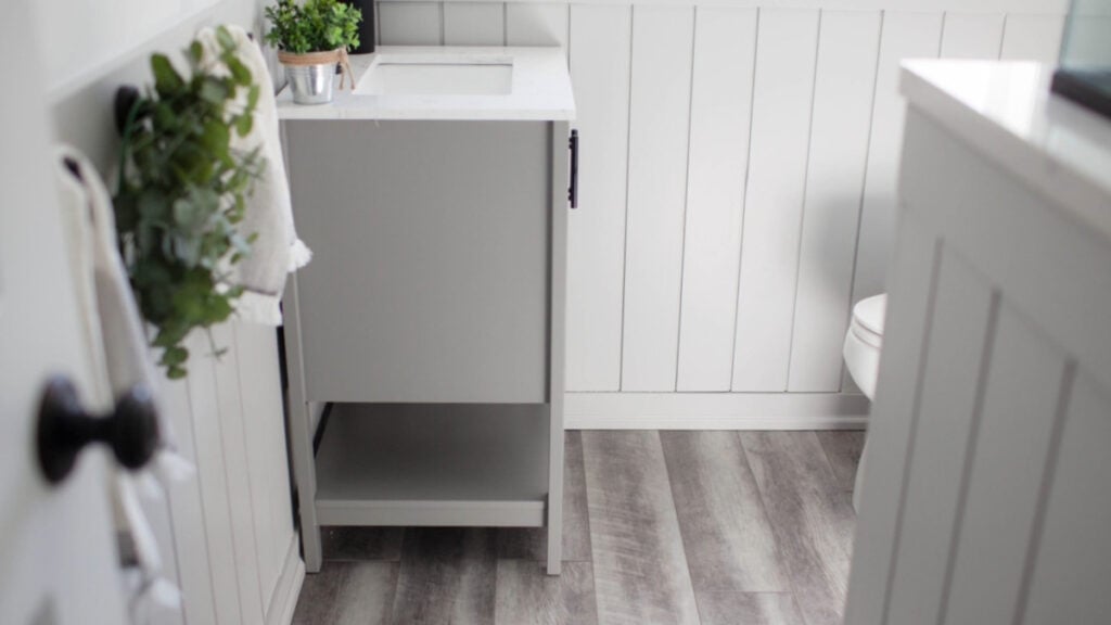 Sherwin Williams LIght French Gray with LVP tile flooring in gray tones, shiplap walls