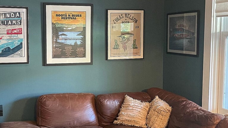 Sherwin Williams Riverway, blue-green paint color in den with brown leather sofa