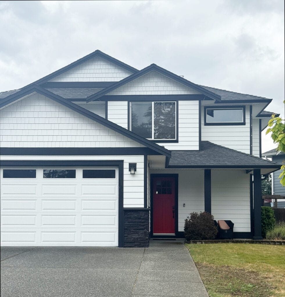 James Hardie Arctic White exterior siding with white windows and black trim.