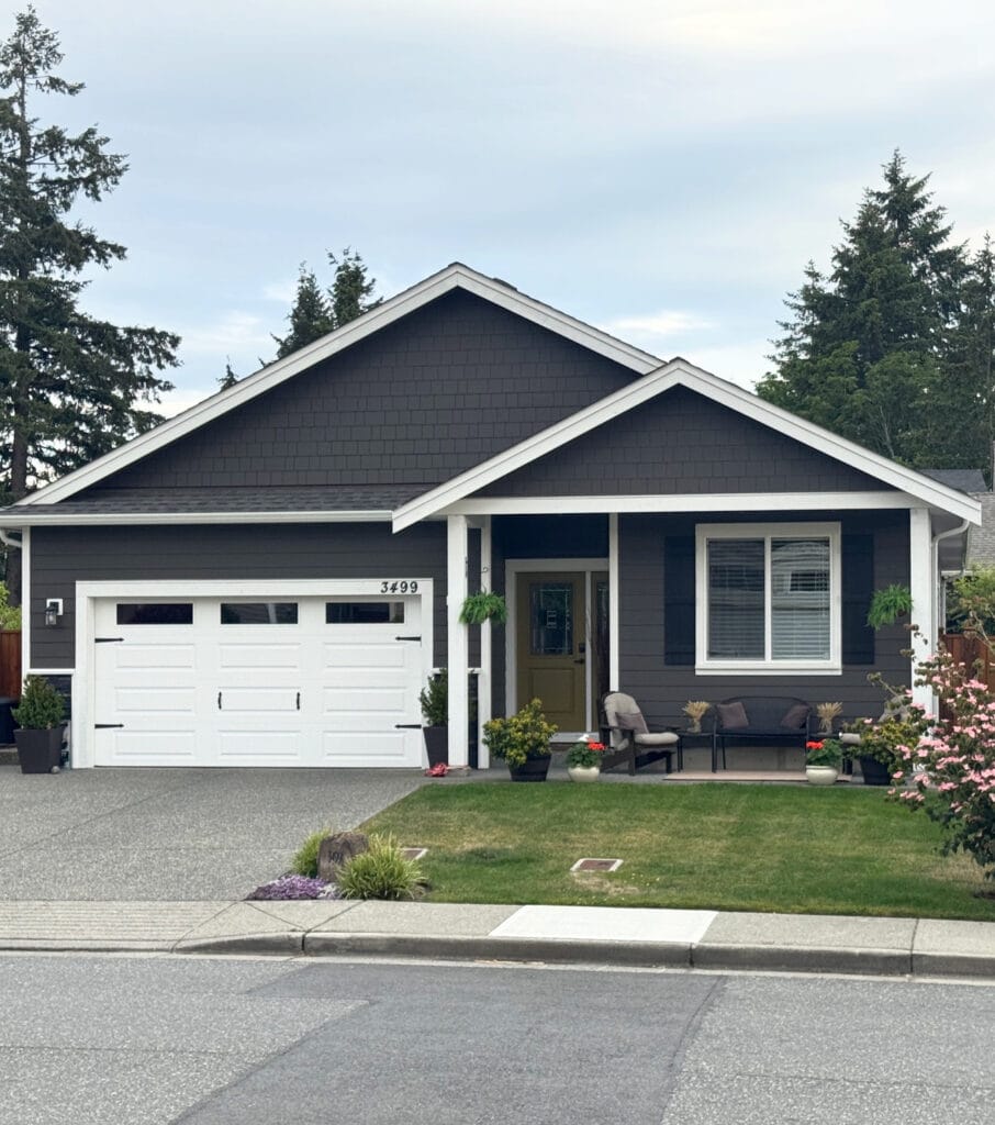 James Hardie Rich Espresso, dark brown exterior siding with BEnjamin Moore Cloud White trim and garage doors