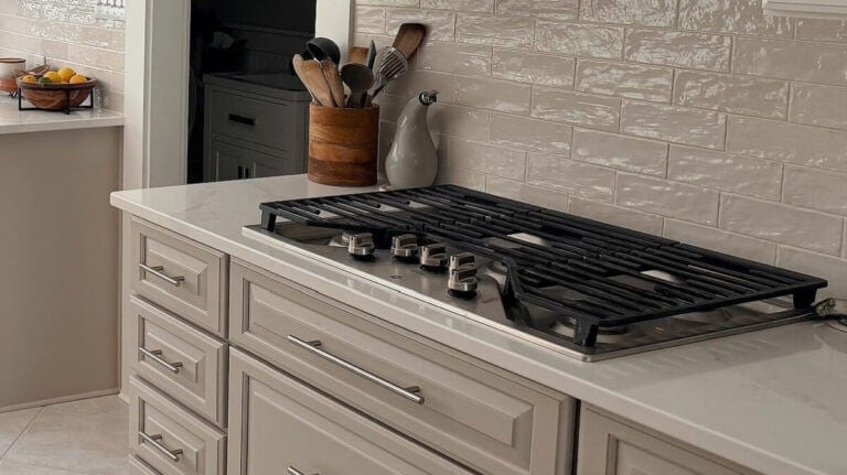 Sherwin-Williams-Versatile-Gray-painted-wood-lower-kitchen-cabinets-existing-warm-gray-taupe-tile-floor-Pure-White-uppers-white-quartz-Cloe-Zellige-tile