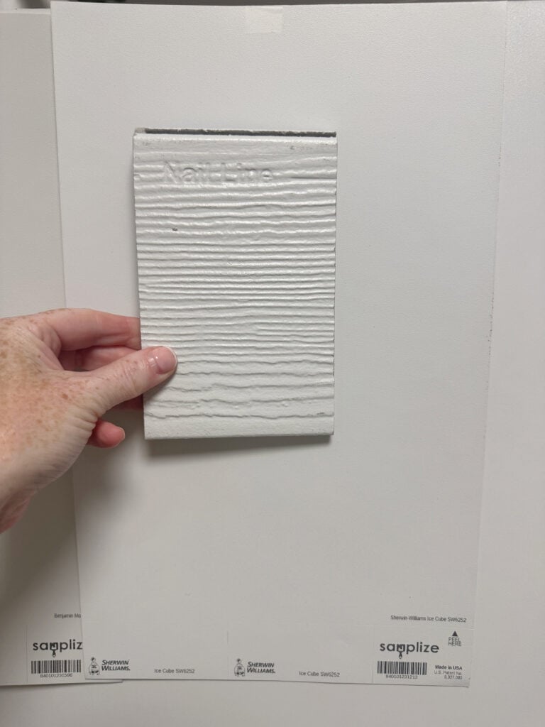 Sherwin Williams off-white gray is the best color match to James Hardie Arctic White siding