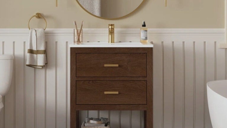 Small bathroom wood vanity with gold hardware, product image from website