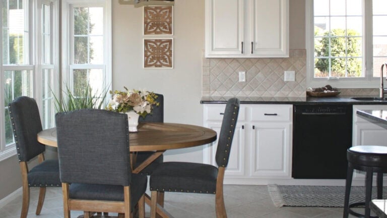 1990 or 2000s painted kitchen cabinets, off-white with black granite, beige tile floor and Sherwin Williams Balanced Beige walls