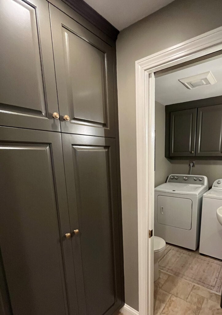 Laundry room with beige tile floor. Walls painted Sherwin Williams INtellectual Gray, cabinets Porpoise, dark greige