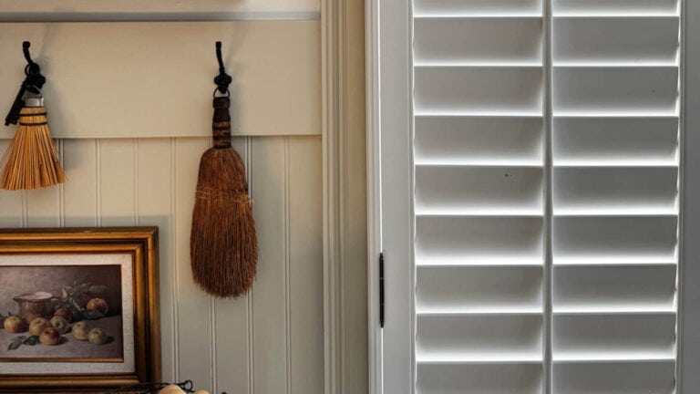Sherwin Williams Snowboumd shutters and trim with beadboard painted Accessible Beige